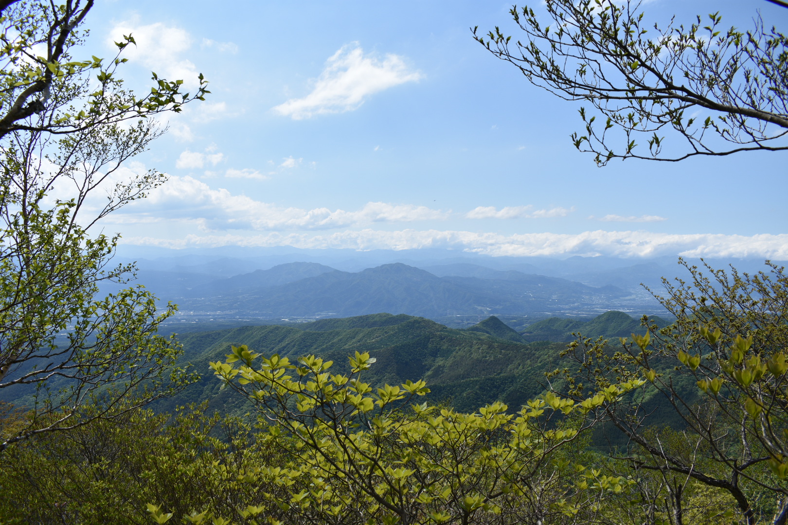 A view from Arayama Peak of blue mountains stretching out in the distance