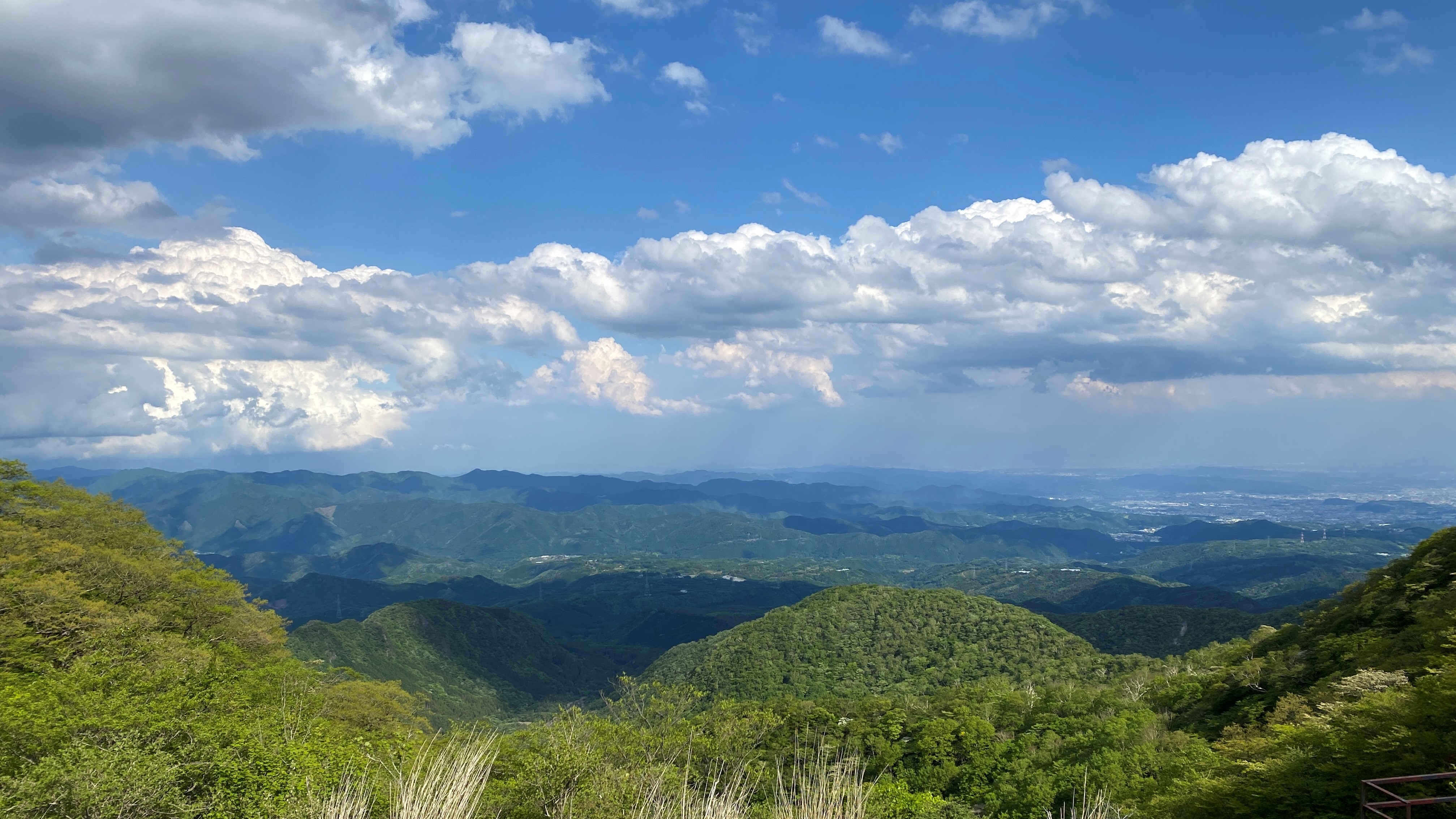 a view of mountains and plains stretching out from Torii Toge viewpoint