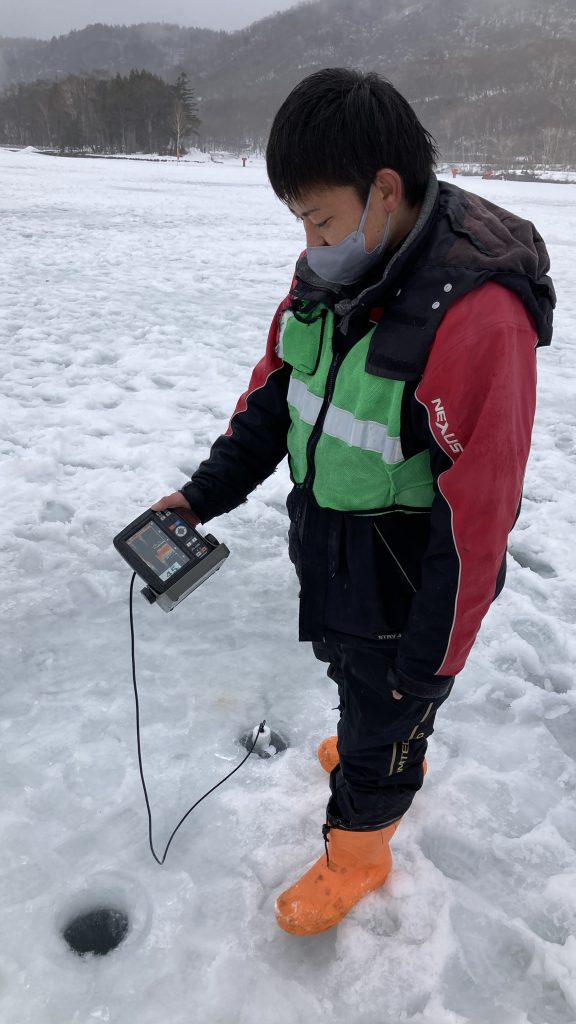 A man checking for fish with a radar