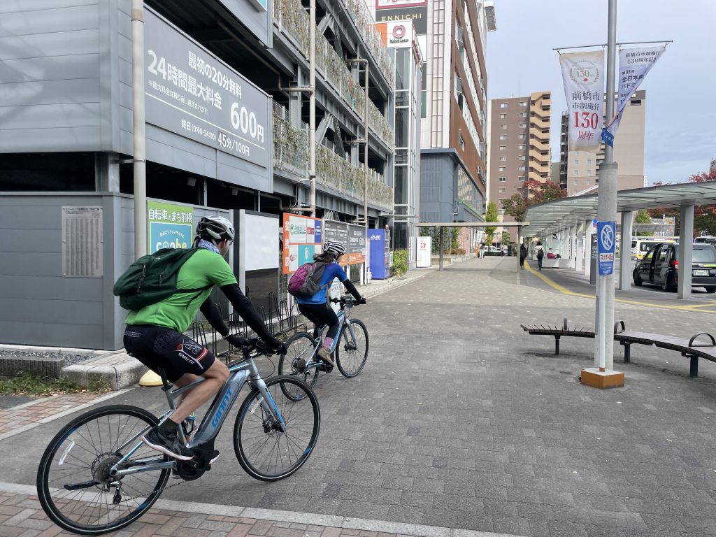 Cyclists riding through a small urban area