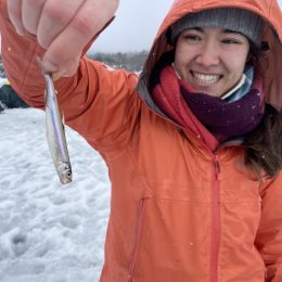 Woman holding a small fish