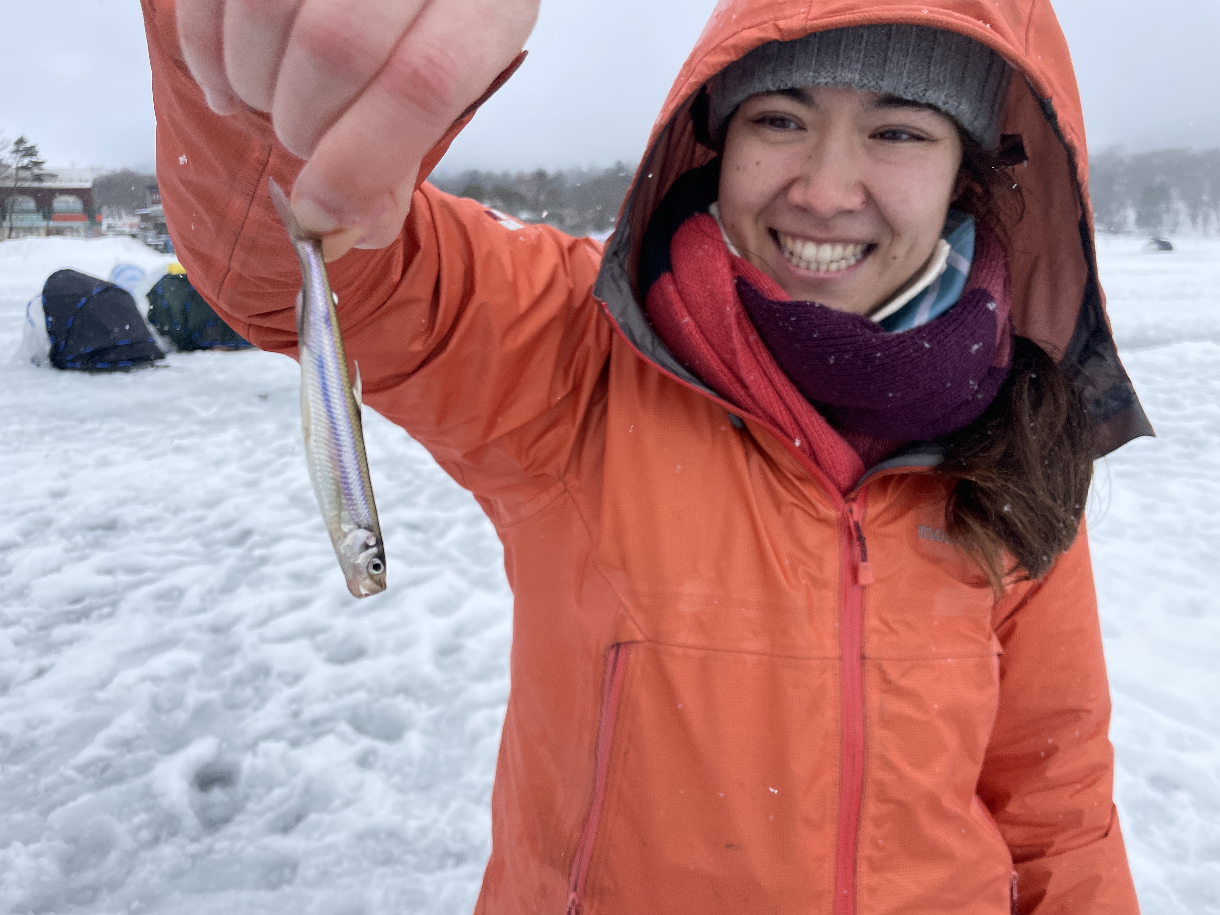 Woman holding a small fish