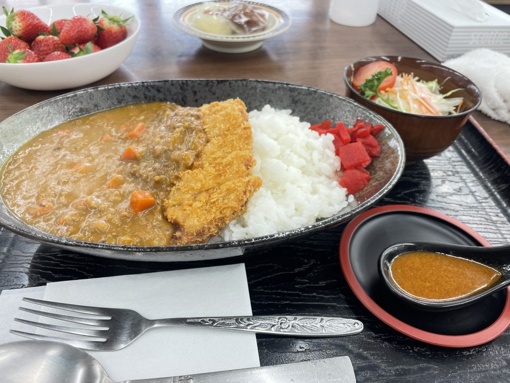 A lunch set with katsu curry and rice